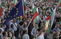 Protesters wave Bulgarian and EU flags as they take part in anti-governmental protest in downtown Sofia on Monday, July 13, 2020.