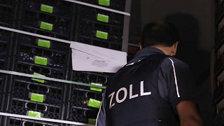 A customs officer stands in a truck in Breitenau, eastern Germany, after the discovery of illegal migrants.