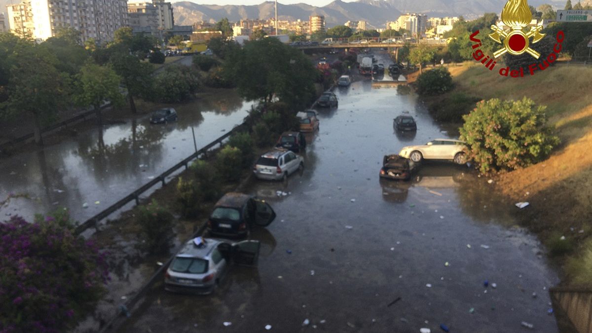 Dozens swim to safety after floods trap cars in Palermo underpass