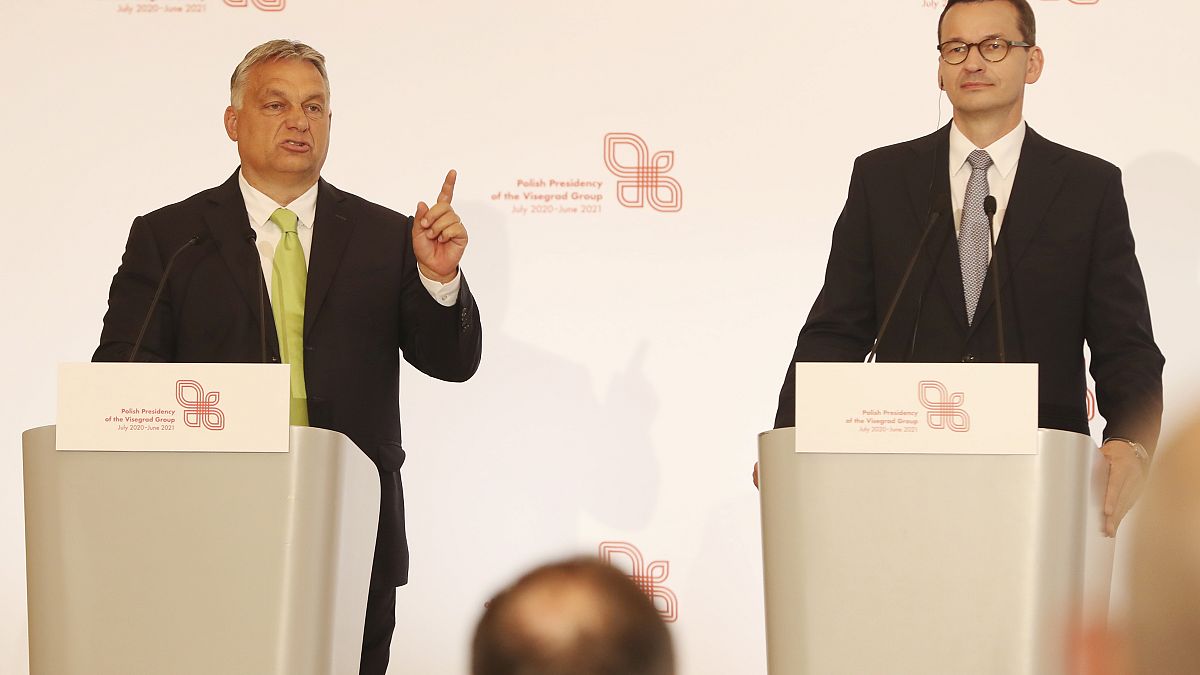 Hungarian Prime Minister Viktor Orban,left, speaks at a join news conference with Poland's Prime Minister Mateusz Morawiecki,right, Jul 3 2020