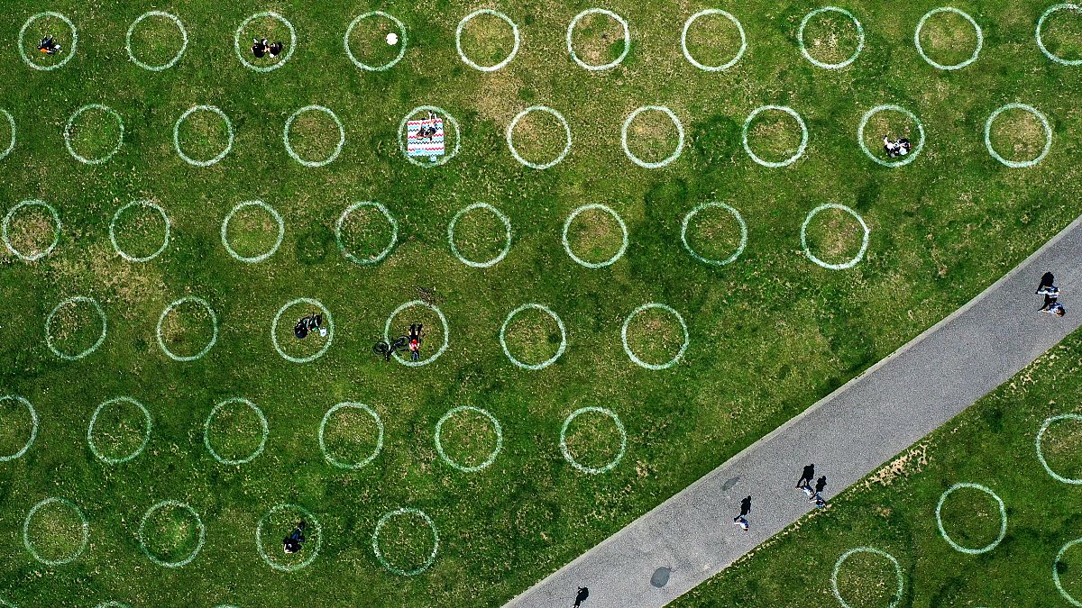 An aerial view shows painted circles for social distancing at the Rhine promenade in Dusseldorf, Germany. July 12, 2020