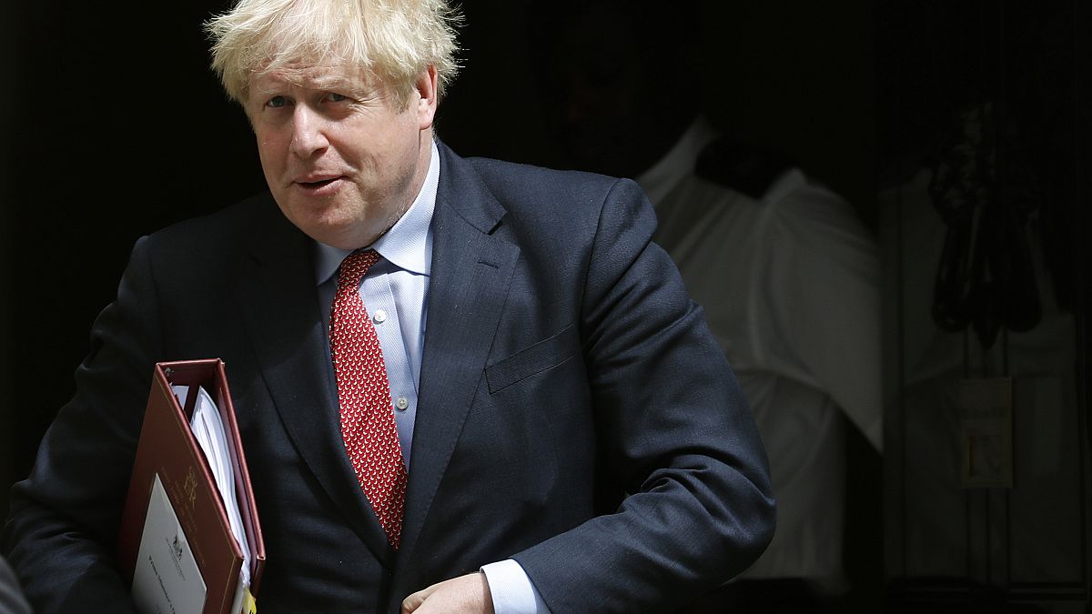 Britain's Prime Boris Johnson leaves 10 Downing Street to attend the weekly Prime Minister's Questions session, in parliament in London, Wednesday, July 15, 2020. 