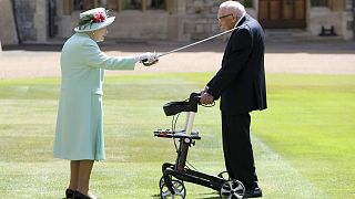 Captain Sir Tom Moore receives his knighthood from Her Majesty the Queen at Windsor.