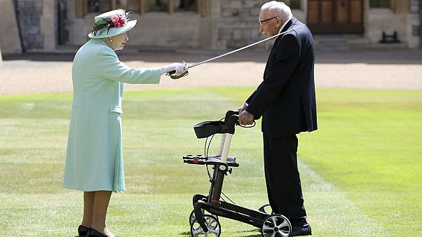 Captain Sir Tom Moore receives his knighthood from Her Majesty the Queen at Windsor. Captain Sir Tom Moore receives his knighthood from Her Majesty the Queen at Windsor.