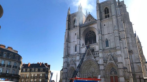 Fire fighters brigade work to extinguish the blaze at the Gothic St. Peter and St. Paul Cathedral, in Nantes, western France, Saturday, July 18, 2020 Fire fighters brigade work to extinguish the blaze at the Gothic St. Peter and St. Paul Cathedral, in Nantes, western France, Saturday, July 18, 2020