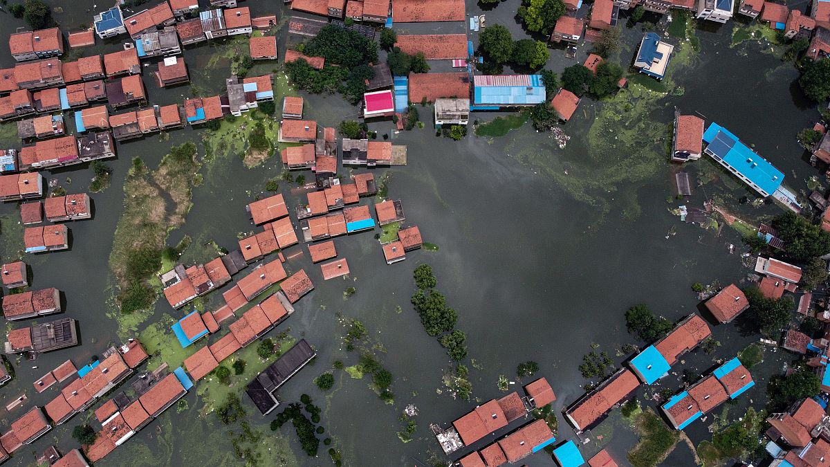 An aerial view shows flooded residential buildings due to rising water levels of the Yangtze river in Jiujiang, China's central Jiangxi province.