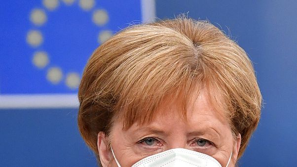 German Chancellor Angela Merkel arrives for an EU summit at the European Council building in Brussels, Sunday, July 19, 2020