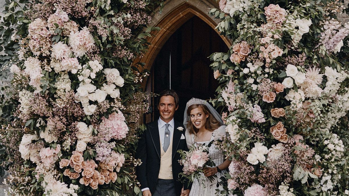 Princess Beatrice and Edoardo Mapelli Mozzi stand in the doorway of The Royal Chapel of All Saints at Royal Lodge, Windsor, England, after their wedding.