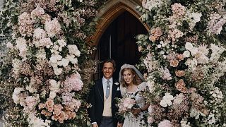 Princess Beatrice and Edoardo Mapelli Mozzi stand in the doorway of The Royal Chapel of All Saints at Royal Lodge, Windsor, England, after their wedding.