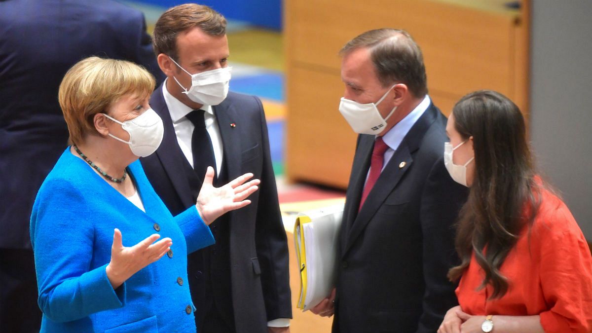 German Chancellor Angela Merkel, left, and French President Emmanuel Macron, second left, speak with Sweden's Prime Minister Stefan Lofven, second right, and Finland's Prime M