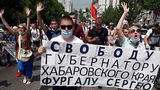 People hold posters reading "Freedom for Khabarovsk region's governor Sergei Furgal" during an unsanctioned protest in Khabarovsk, Russia. July 18, 2020.