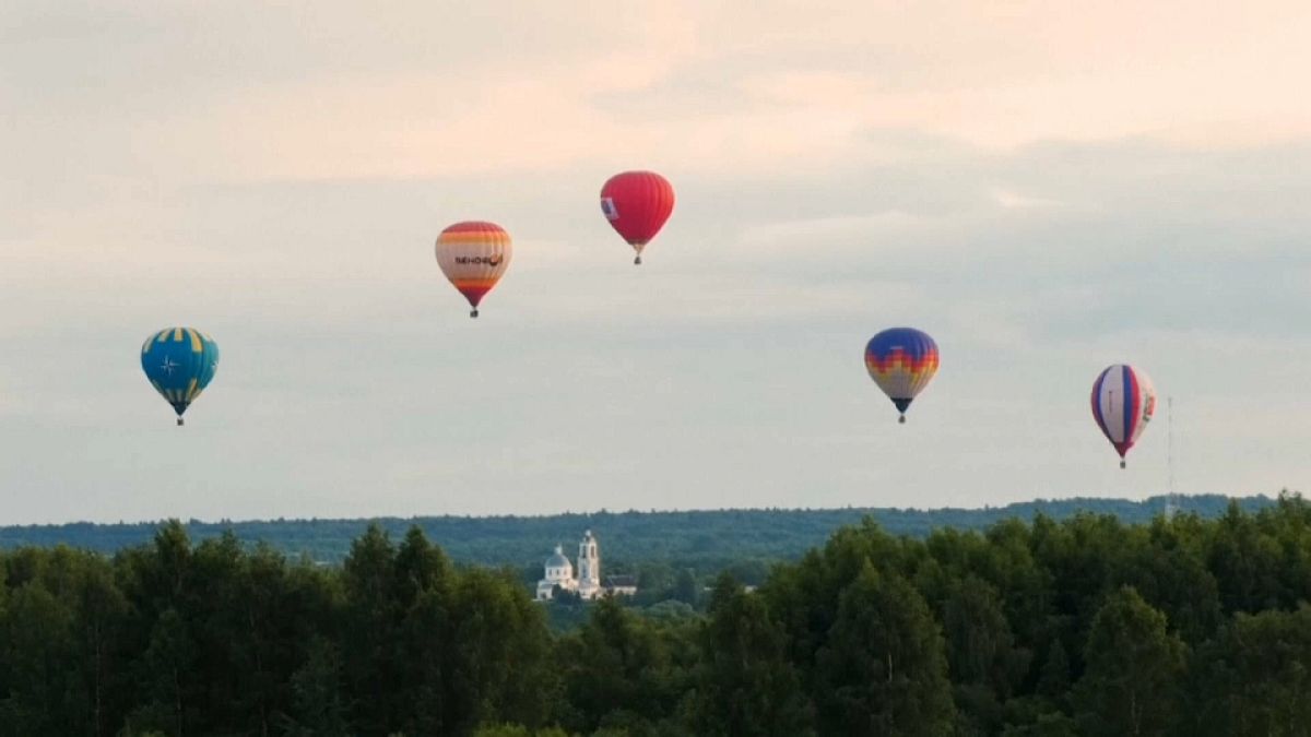 Hot air balloons fill the sky after three month delay to festival