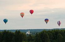 Hot air balloons fill the sky after three month delay to festival