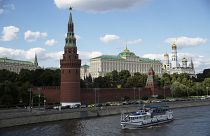 A tourist boat passes the Kremlin in Moscow, Russia, Friday, July 10, 2020