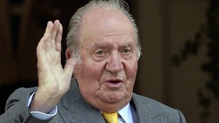 FILE: Spain's former monarch King Juan Carlos waves upon his arrival to the Academia Diplomatica de Chile, in Santiago.