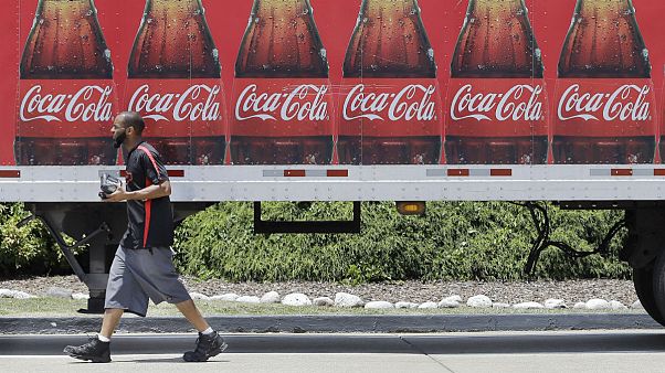 A worker delivers Coca Cola products in Nashville, Tenn A worker delivers Coca Cola products in Nashville, Tenn