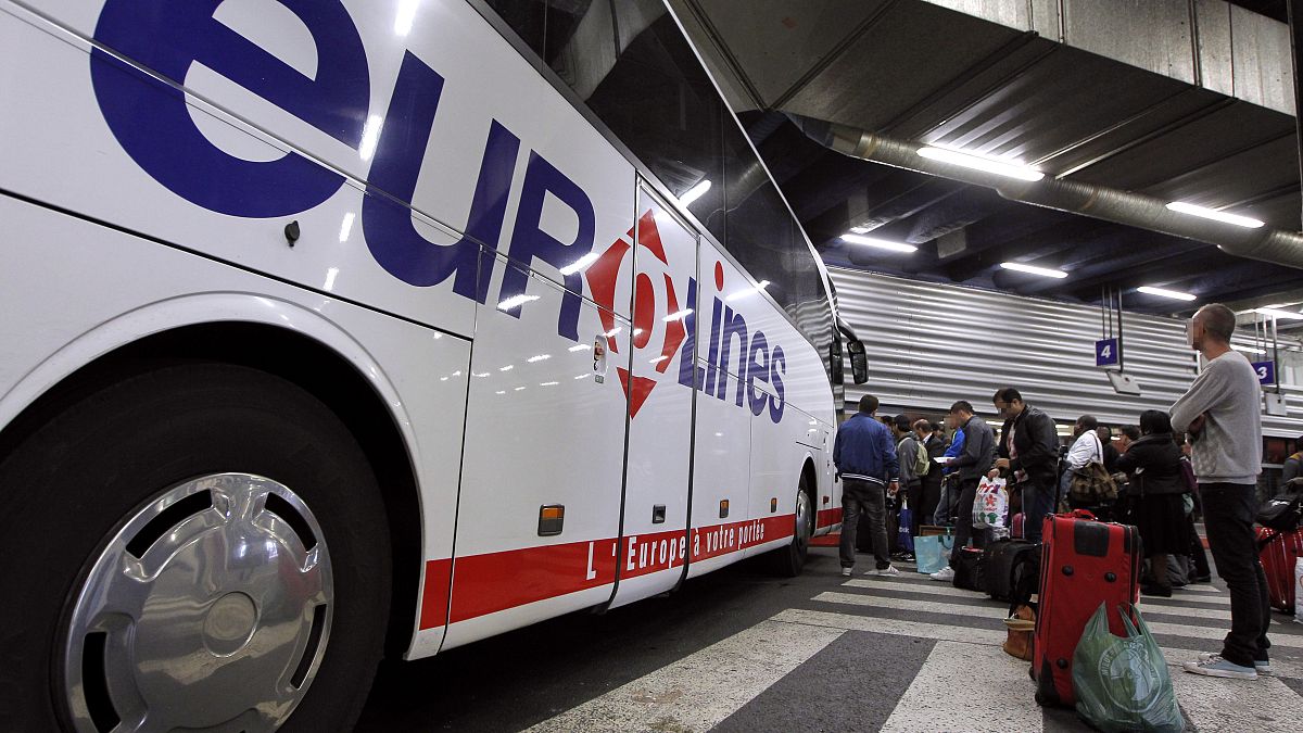 Passengers wait to board a Eurolines bus in France. 6 April, 2012.