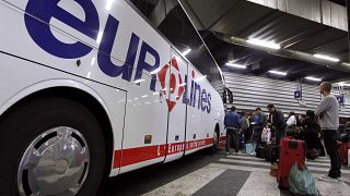 Passengers wait to board a Eurolines bus in France. 6 April, 2012.