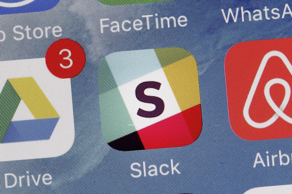 The Slack app is displayed on a mobile phone.