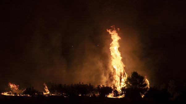 Fire burns near the village of Galataki as authorities evacuate the place near Corinth, Greece Fire burns near the village of Galataki as authorities evacuate the place near Corinth, Greece