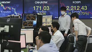 Currency traders watch monitors at the foreign exchange dealing room of the KEB Hana Bank headquarters in Seoul, South Korea