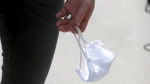A person carries a face mask in Vienna, Austria, July 21, 2020. A person carries a face mask in Vienna, Austria, July 21, 2020.