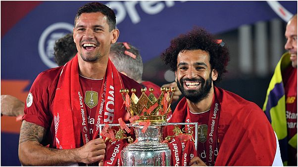 لاعبون من فريق ليفربول يحتلفون بلقب الدوري الممتاز لاعبون من فريق ليفربول يحتلفون بلقب الدوري الممتاز