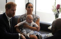 Prince Harry and Meghan, Duchess of Sussex, holding their son Archie.