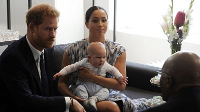 Prince Harry and Meghan, Duchess of Sussex, holding their son Archie.