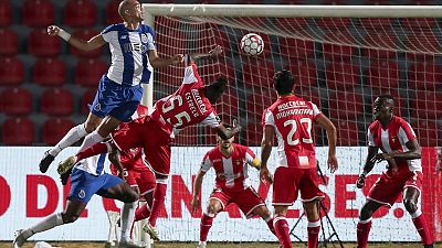 Porto's Pepe, left, jumps for the ball with CD Aves' Estrela during the Portuguese League soccer match between CD Aves and FC Porto