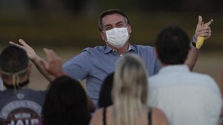 The Brazilian President greeted supporters shortly after announcing he was COVID-19 free. 