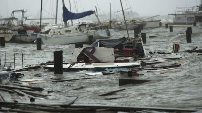 Loose and damaged boats are tossed around after the docks at the marina where they had been secured were destroyed as Hurricane Hanna made landfall