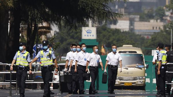 Chinese security personnel walk outside the United States Consulate in Chengdu in southwest China's Sichuan province on Monday, July 27, 2020 Chinese security personnel walk outside the United States Consulate in Chengdu in southwest China's Sichuan province on Monday, July 27, 2020