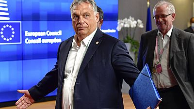 In this Saturday, July 18, 2020, file photo, Hungary's Prime Minister Viktor Orban gestures at an EU summit in Brussels. 