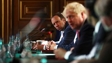 Britain's Health Secretary Matt Hancock (L) and Britain's Prime Minister Boris Johnson at the Foreign and Commonwealth office in London on July 21, 2020.