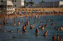 Bathers enjoy the beach in Cadiz, south of Spain, on Friday, July 24, 2020. 