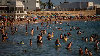 Bathers enjoy the beach in Cadiz, south of Spain, on Friday, July 24, 2020. 