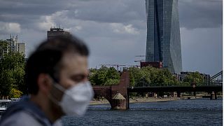  A man walks in front of the European Central Bank in Frankfurt, Germany