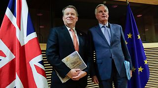 EU chief Brexit negotiator Michel Barnier, right, speaks with the British Prime Minister's Europe adviser David Frost during Brexit trade talks, Brussels, July 9, 2020.