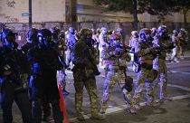 Federal officers begin dispersing a group of demonstrators during a Black Lives Matter protest Monday, July 27, 2020, in Portland, Oregon.
