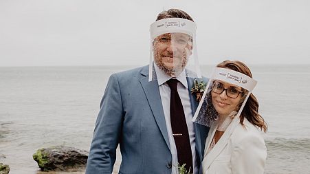 World's first couple get married in plastic-free PPE