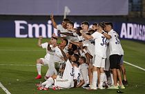 Real Madrid's players pose for the photographers with the trophy as they celebrate winning the Spanish La Liga 2019-2020.