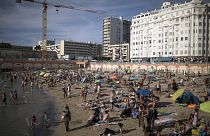 Beachgoers enjoy the sun at the Plage des Catalans in Marseille, southern France, July 25, 2020. 