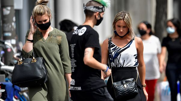 Personas con mascarilla en Amberes, Bélgica Personas con mascarilla en Amberes, Bélgica