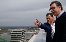 In this Friday, April 5, 2019, photo, Serbia's finance minister Sinisa Mali, left, speaks with Serbia's President Aleksandar Vucic in Belgrade, Serbia