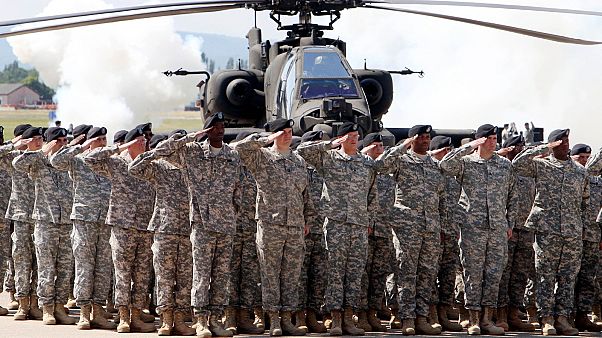 In this Friday, May 13, 2011 file photo, Soldiers of 1AD attend a color casing ceremony of the First Armored Division at the US Army Airfield in Wiesbaden, Germany. In this Friday, May 13, 2011 file photo, Soldiers of 1AD attend a color casing ceremony of the First Armored Division at the US Army Airfield in Wiesbaden, Germany.