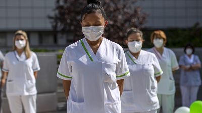 Workers of a nursing home "DomusVi Arturo Soria" hold a minute of silence in support of the social and health sector and its workers in Madrid, Spain