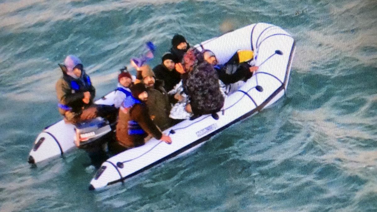 Migrants aboard a rubber boat after being intercepted by French authorities, off the port of Calais, northern France, in December 2018.