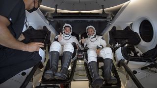 NASA astronauts Robert Behnken, left, and Douglas Hurley are seen inside the SpaceX Crew Dragon Endeavour spacecraft shortly after landing in the Gulf of Mexico, 02/08/2020.