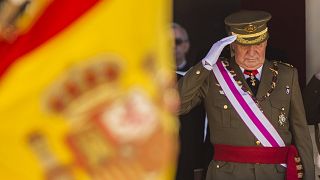 In this June 3, 2014 file photo then King Juan Carlos attends a military ceremony in San Lorenzo de El Escorial, outside Madrid, Spain.